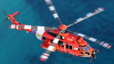 Rescue Helicopter Over Turquoise Waters wallpaper
