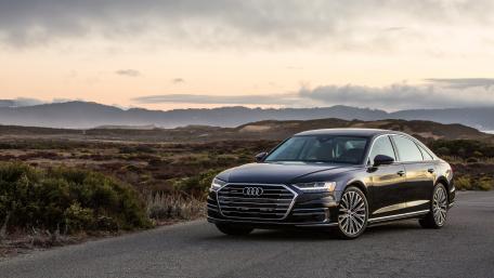 Sleek Audi A8 Against a Scenic Backdrop wallpaper