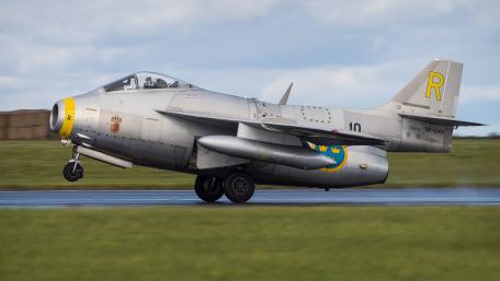 Fighter Jet in Action Over Fields wallpaper