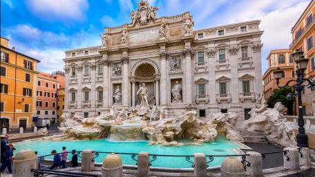 Majestic Trevi Fountain in Vibrant Cityscape wallpaper