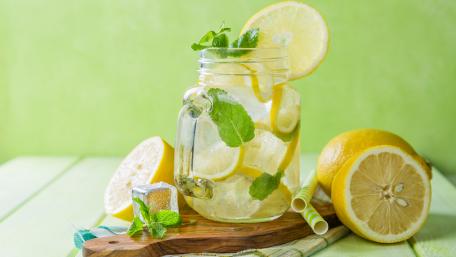 Refreshing Lemonade in a Jar with Mint Leaves and Ice Cubes wallpaper