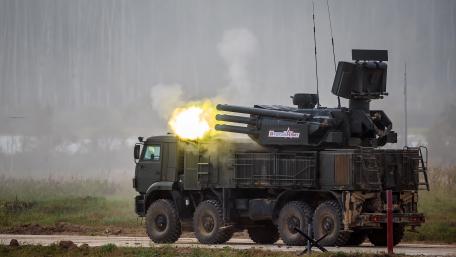 Military Vehicle in Action with Advanced Weaponry wallpaper