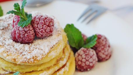 Delicious Pancakes with Raspberries and Mint Decoration wallpaper