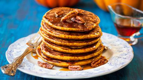 Delicious Stack of Pumpkin Pancakes with Maple Syrup wallpaper