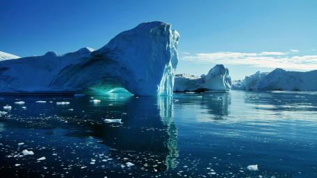 Majestic Icebergs Reflected in Serene Waters wallpaper