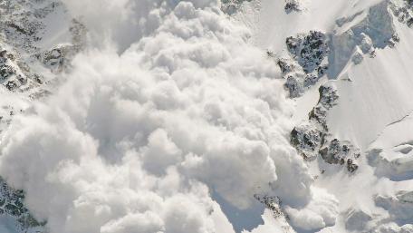Majestic Avalanche Transforming Snowy Peaks wallpaper