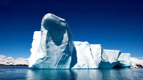 Majestic Iceberg Under a Clear Blue Sky wallpaper