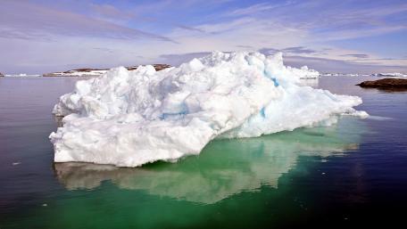 Majestic Iceberg Reflections in Tranquil Waters wallpaper