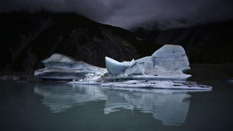 Majestic Iceberg Reflections in a Serene Lake wallpaper