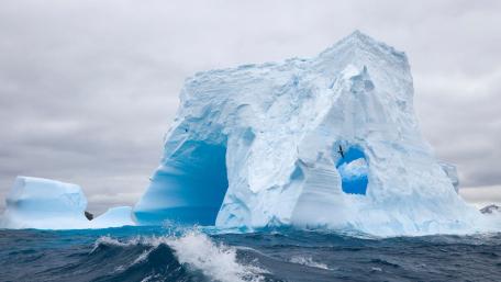 Majestic Iceberg against a Dramatic Sky wallpaper