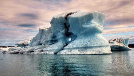 Majestic Iceberg Reflections in Tranquil Waters wallpaper