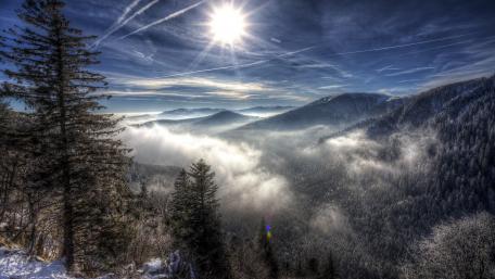 Tranquil Mountain Vista Under a Shimmering Sunlight wallpaper
