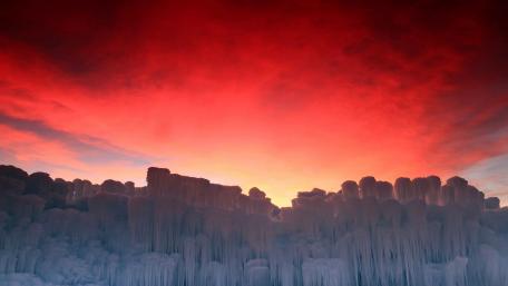 Majestic Ice Formations Under Colorful Skies wallpaper