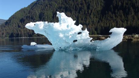 Majestic Iceberg Reflections in Tranquil Waters wallpaper