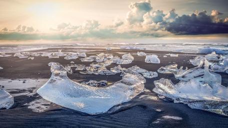 Stunning Ice Formations on Serene Shoreline wallpaper