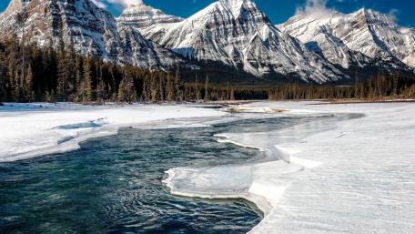 Majestic Winter Landscape with Snow-Covered Mountains wallpaper
