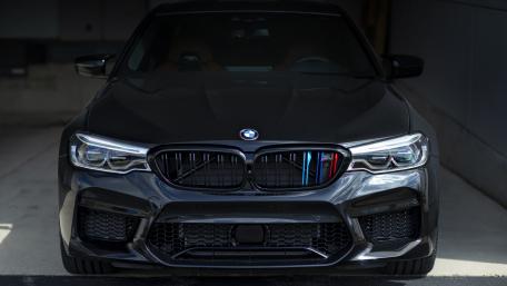 Sleek Black BMW M5 Front View Wallpaper wallpaper