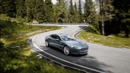 Elegant Car on Curvy Mountain Road wallpaper