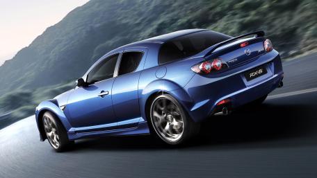 Sleek and Stylish Blue Sports Car Wallpaper wallpaper