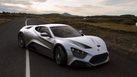 Sleek Silver Supercar on an Open Road wallpaper