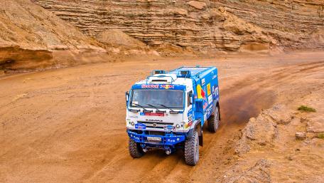 Adventure on Wheels in the Desert Landscape wallpaper