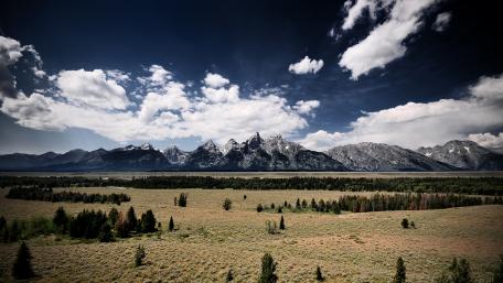 Majestic Mountain Range Under Expansive Sky wallpaper