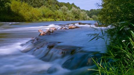 Tranquil Flowing River Scene wallpaper