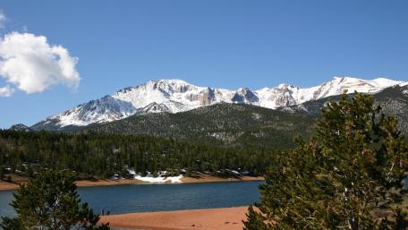 Majestic Mountains Reflected in Tranquil Waters wallpaper