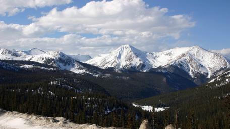 Majestic Snow-Capped Mountains Under Clear Skies wallpaper