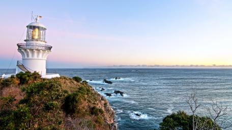 Serene Lighthouse Overlooking the Tranquil Sea wallpaper