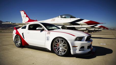Sleek Muscle Car Meets Powerful Jet Fighter wallpaper