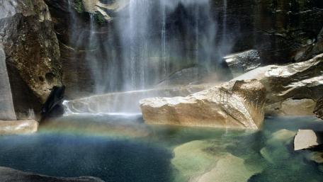 Majestic Waterfall with Rainbow Reflection wallpaper