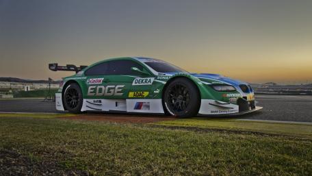 Dynamic Race Car at Sunset Scene wallpaper