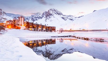Serene Mountain Village in Winter Wonderland wallpaper