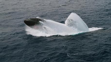 Submarine Surfaces in Majestic Action wallpaper
