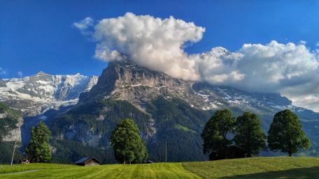 Majestic Swiss Mountain Landscape with Clouds wallpaper