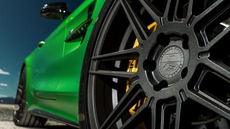 Vibrant Green Car Close-up Wallpaper wallpaper