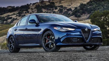 Sleek Blue Performance Car on Scenic Landscape wallpaper