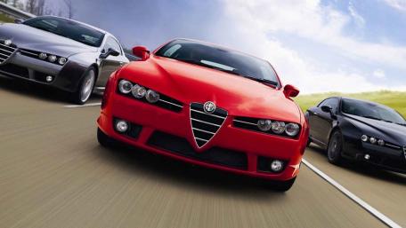 Dynamic Alfa Romeo Trio in Action wallpaper