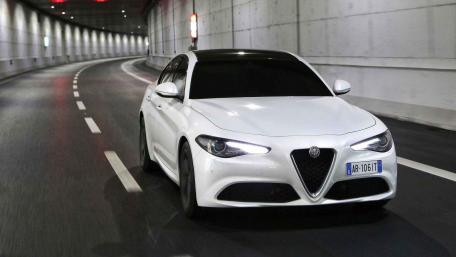 Sleek White Sports Car in Tunnel Scene wallpaper