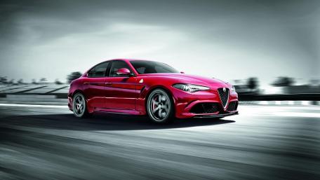 Dynamic Red Sedan in Motion wallpaper