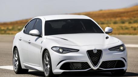 Sleek White Sports Car in Motion wallpaper