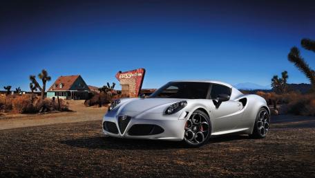 Sleek Silver Sports Car Under a Clear Sky wallpaper
