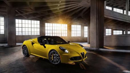 Bold Yellow Sports Car in Industrial Setting wallpaper