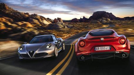 Sleek Alpha Romeo Duo on a Scenic Drive in Nature wallpaper