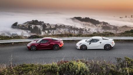 Stunning Car Duo against a Foggy Skyline wallpaper