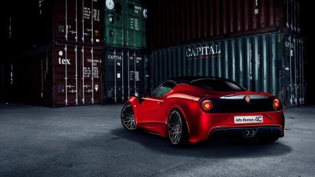 Sleek Red Alfa Romeo 4C in Urban Setting wallpaper