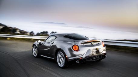 Sleek Silver Car on a Scenic Roadway wallpaper