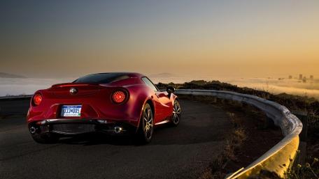 Sleek Red Sports Car at Sunset wallpaper