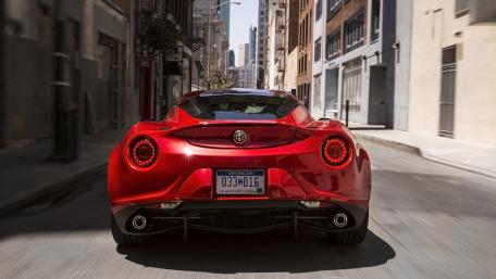 Sleek Red Sports Car in Urban Setting wallpaper